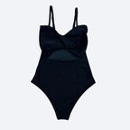 Black one-piece swimsuit and chic fitness wear with thin straps on a light gray background