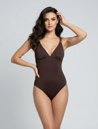 Woman in a brown braided-strap bodysuit designed for gym workouts, pilates, beachwear, and elevated athleisure.
