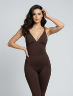 Brown high-cut bodysuit with braided straps for workout and beach-inspired athleisure looks.