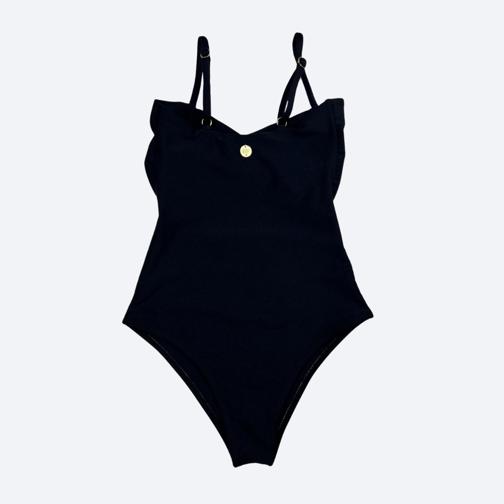 Black swimsuit with thin straps on a light gray background