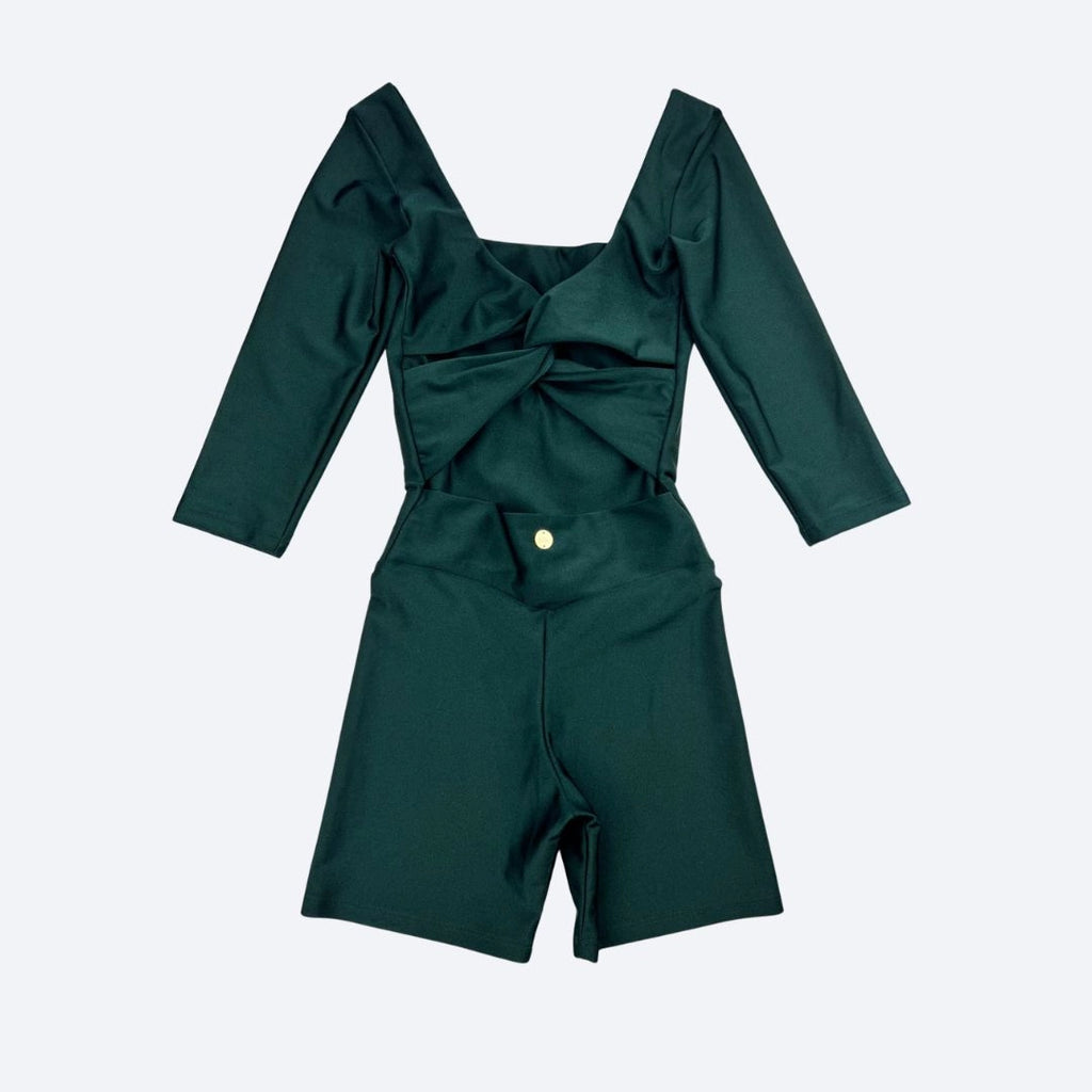 Green Jumpsuit with a twist back detail on a light gray background