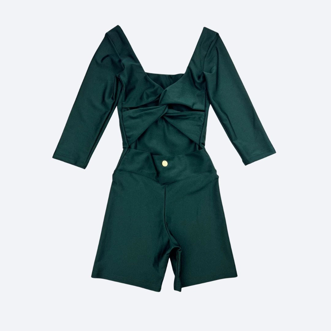 Green Jumpsuit with a twist back detail on a light gray background