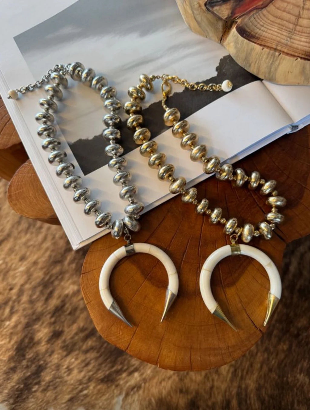 Necklace with horn-like pendants on a wooden surface