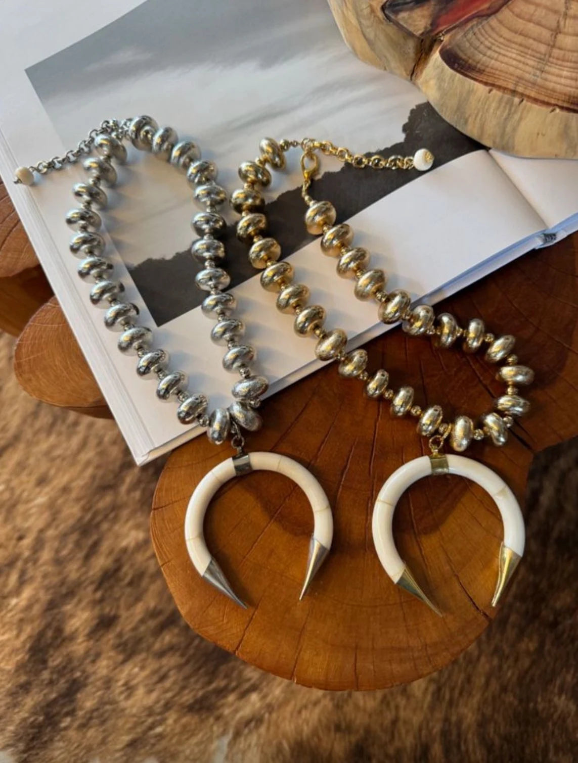 Necklace with horn-like pendants on a wooden surface