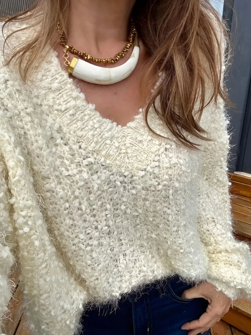 Handcrafted Brazilian necklace with horizontal horn pendant and gold-tone beads, lightweight boho chic jewelry.